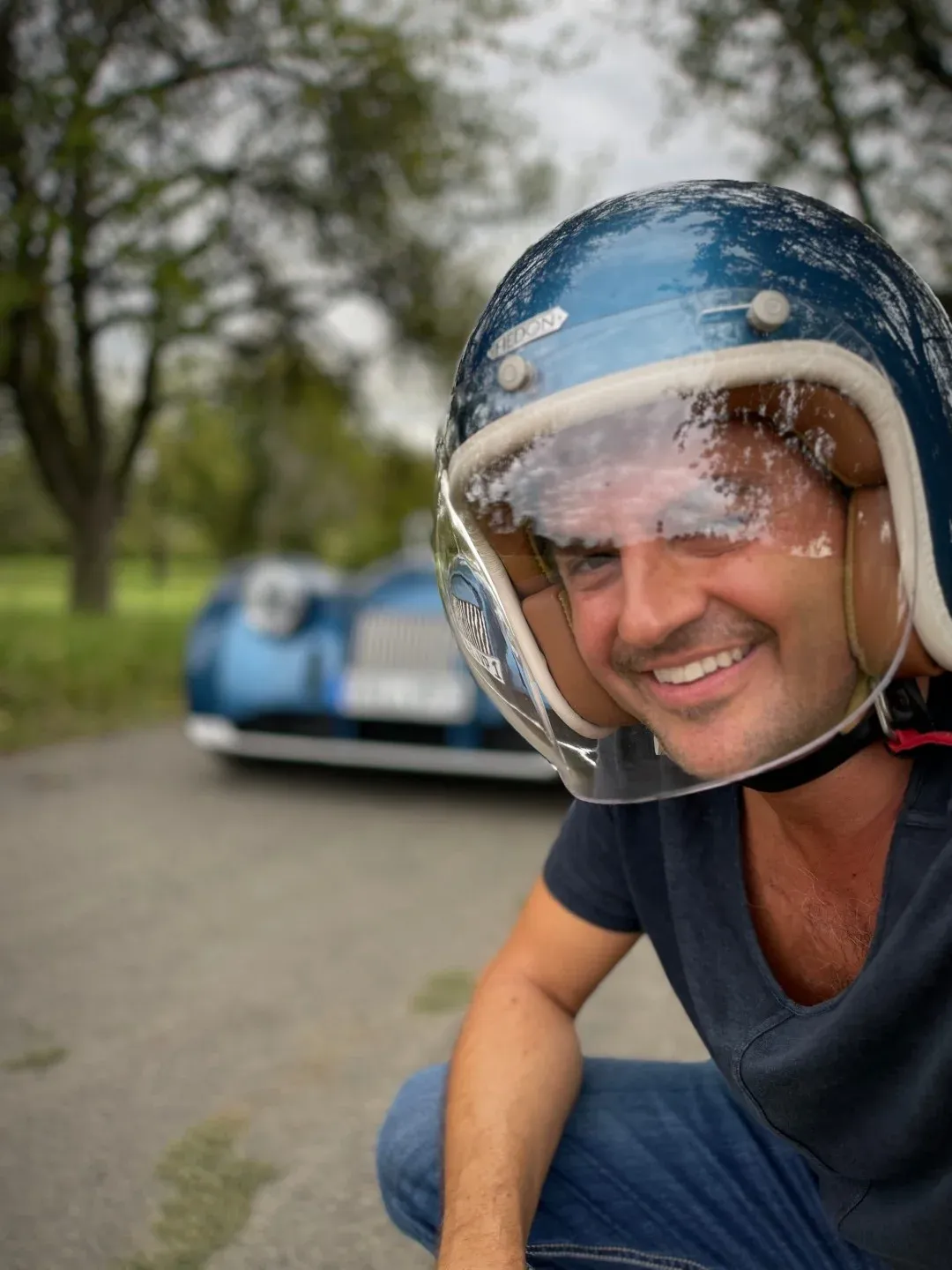The author smiling, wearing an open helmet
